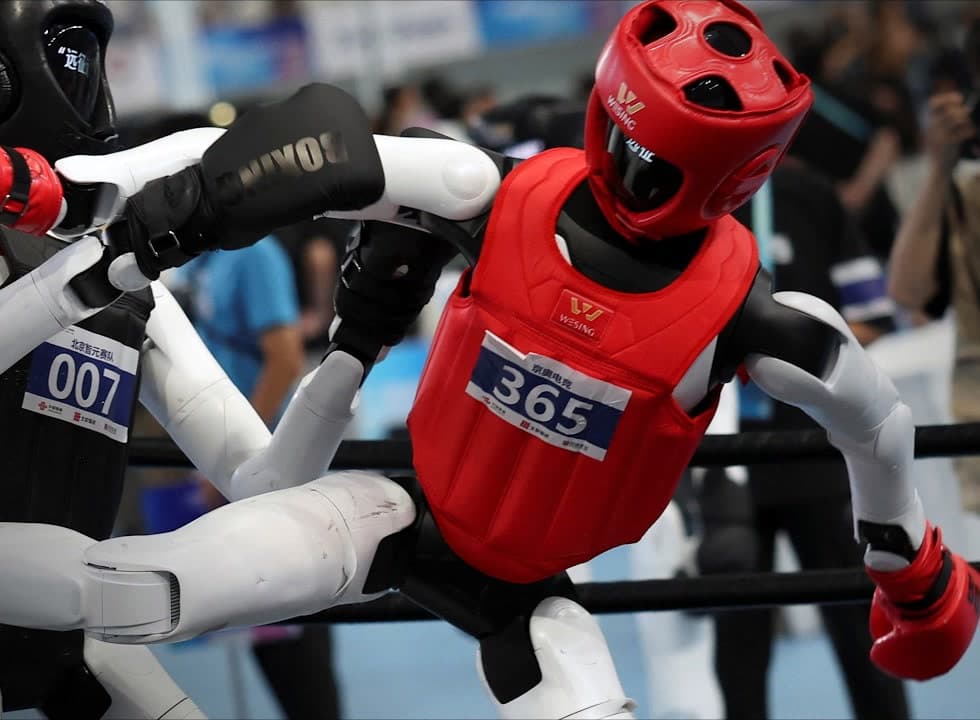 G1s in red and black protective gear fighting in the WHRG kickboxing bracket